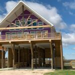 gun-barrel-pilings-and-timber-truss-beach-home